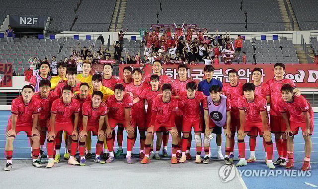South Korean players pose for photos after beating China 3-0 in the teams' first match of the East Asian Football Federation E-1 Football Championship at Yongin Mireu Stadium in Yongin, Gyeonggi Province, on July 7, 2025. (Yonhap)