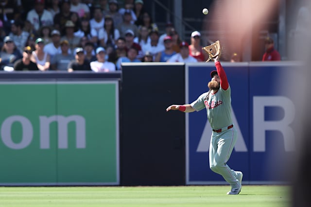 SAN DIEGO, CALIFORNIA – JULY 13: Brandon Marsh #16 of the Philadelphia Phillies makes a catch in the outfield in the eighth inning against the San Diego Padres at Petco Park on July 13, 2025 in San Diego, California. (Photo by Joe Scarnici/Getty Images)