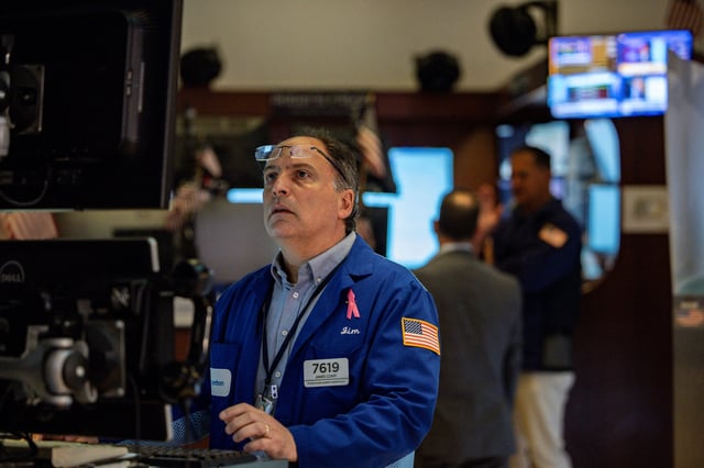 A trader works on the floor at the New York Stock Exchange (NYSE) in New York City, U.S., July 11, 2025. REUTERS/Jeenah Moon/File Photo