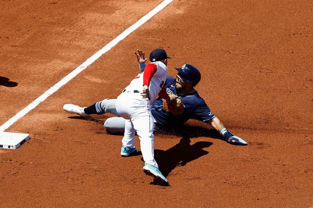 Boston 3rd baseman  Alex Bregman tags out Tampa Bay&#39;s Jonathan Aranda trying to advance on a single during the third inning at Fenway Park on Sunday.  (Photo By Winslow Townson/Getty Images)