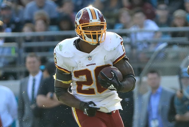 Adrian Peterson #26 of the Washington Redskins runs for yardage during the game against the Jacksonville Jaguars at TIAA Bank Field on December 16, 2018 in Jacksonville, Florida.