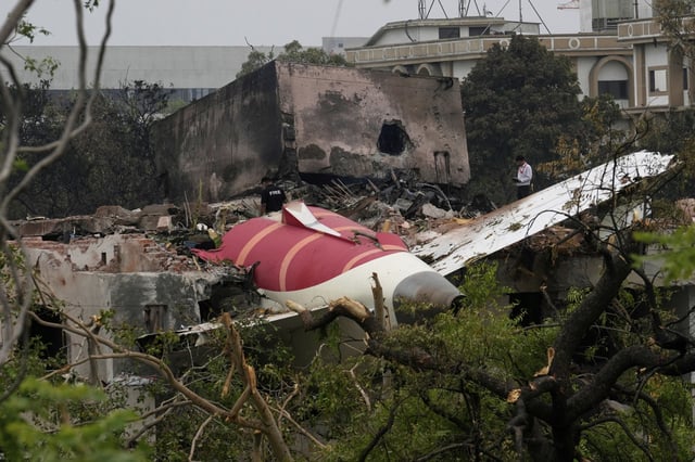 Parts of an Air India plane that crashed on Thursday are seen on top of a building in Ahmedabad, India, Friday, June 13, 2025.