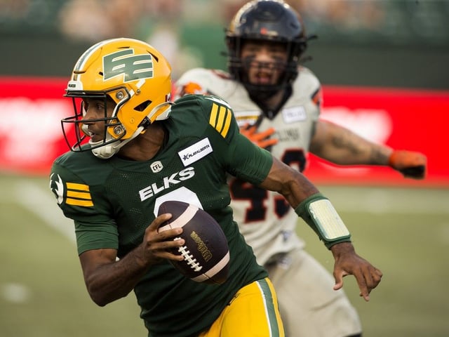The Edmonton Elks' quarterback Tre Ford (2) is forced to run the ball against the B.C. Lions during CFL action at Commonwealth Stadium in this 2024 file photo.