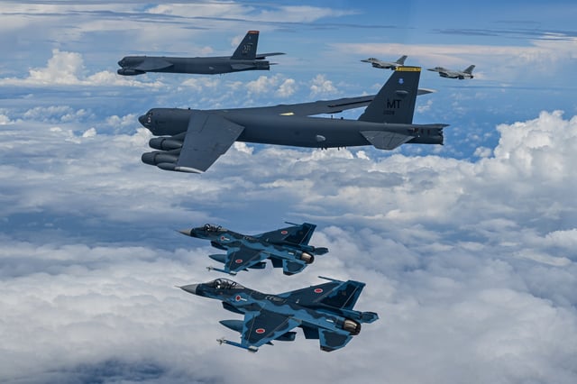 Fighter aircraft from Japan and South Korea conducted a trilateral escort flight of two United States B-52H bombers, middle, over the East China Sea on July 11, 2025.