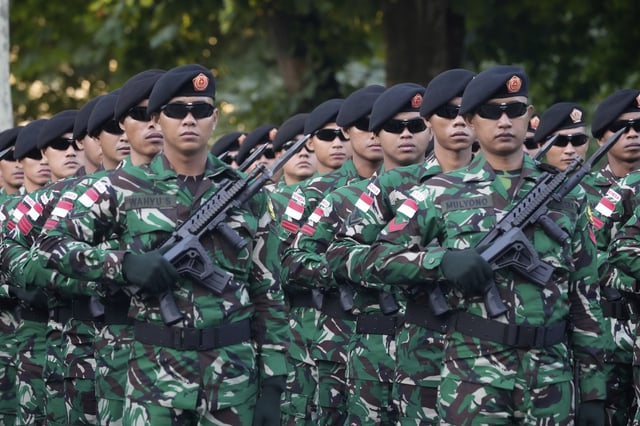 Indonesian troops march during a rehearsal for the upcoming Bastille Day parade, Wednesday, July 9, 2025 on the Champs-Elysees avenue in Paris. (AP Photo/Michel Euler)