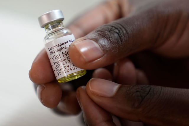 A pharmacist holds a vial of lenacapavir, at the Desmond Tutu Health Foundation's Masiphumelele Research Site, in Cape Town, South Africa, Tuesday, July 23, 2024. (AP Photo/Nardus Engelbrecht)