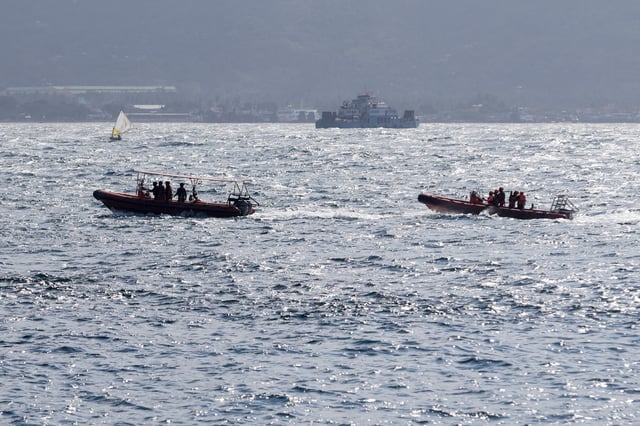 Indonesia rescue team members sail on dinghies during a search operation for missing passengers, after the KMP Tunu Pratama Jaya ferry carrying 65 people sank near the Indonesian island of Bali, in Bali, Indonesia, July 3, 2025. REUTERS/Johannes P. Christo