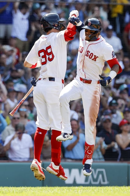 Boston Red Sox's Ceddanne Rafaela celebrates with Marcelo Mayer (39) after hitting a two run homer in the sixth inning of a baseball game, Sunday, July 13, 2025, in Boston. (AP Photo/Greg M. Cooper)