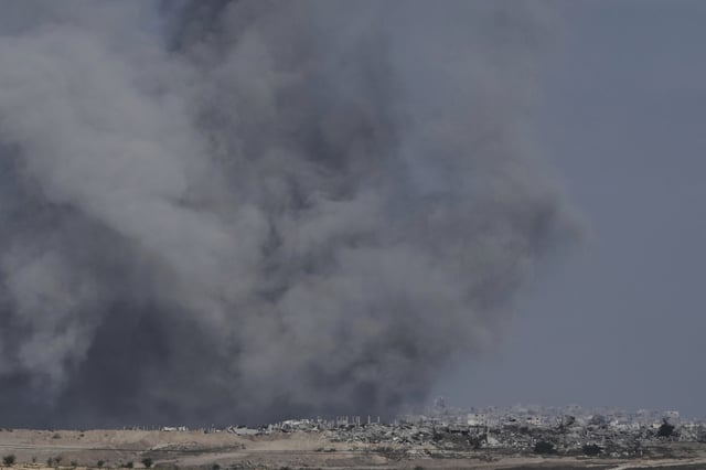 Smoke from Israeli bombardment of the northern Gaza Strip near the Israel-Gaza border, seen from southern Israel, Monday, July 14, 2025. (AP Photo/Maya Alleruzzo)