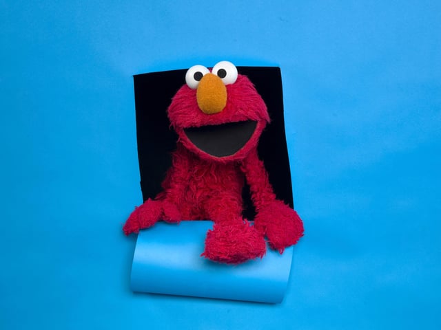 FILE - Elmo of the film "Being Elmo" poses for a portrait in the Fender Music Lodge during the 2011 Sundance Film Festival in Park City, Utah on Jan. 24, 2011. (AP Photo/Victoria Will, File)
