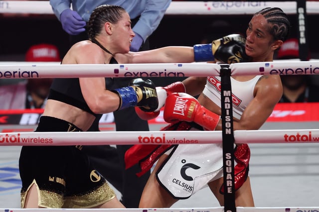Jul 11, 2025; New York, New York, UNITED STATES; Amanda Serrano (red gloves) and Katie Taylor (blue gloves) fight during the undisputed super lightweight championship boxing bout at Madison Square Garden. Mandatory Credit: Vincent Carchietta-Imagn Images