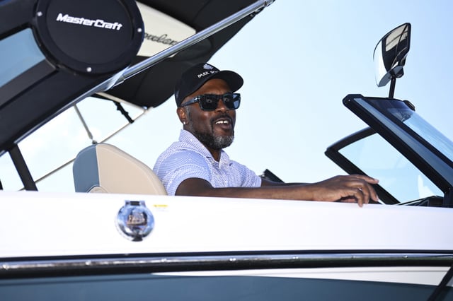 Jimmy Rollins sits in the boat he won for hitting a hole in one on the 12th hole after the second round of the American Century Championship at Edgewood Tahoe Golf Course on July 12, 2025 in Stateline, Nevada.
