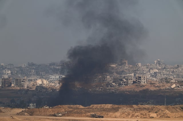 Smoke rises following an explosion in Gaza, as seen from the Israeli side of the Israel-Gaza border, July 13, 2025. REUTERS/Amir Cohen