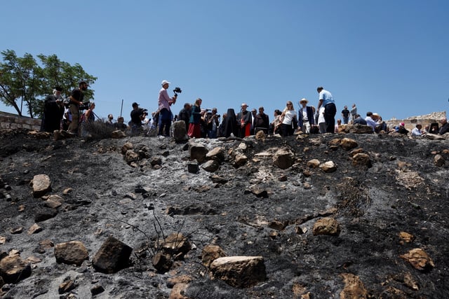 Church leaders and diplomatic envoys visit the town of Taybeh, a Chrisian village in the Israeli-Occupied West Bank, following settler attacks, July 14, 2025. REUTERS / Mohammed Torokman