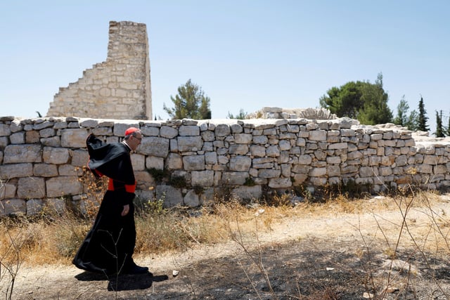 Latin Patriarch in Jerusalem Pierbattista Pizzaballa walks during the visit of the town of Taybeh, a Christian village in the Israeli-Occupied West Bank, following settler attacks, July 14, 2025. REUTERS / Mohammed Torokman     TPX IMAGES OF THE DAY