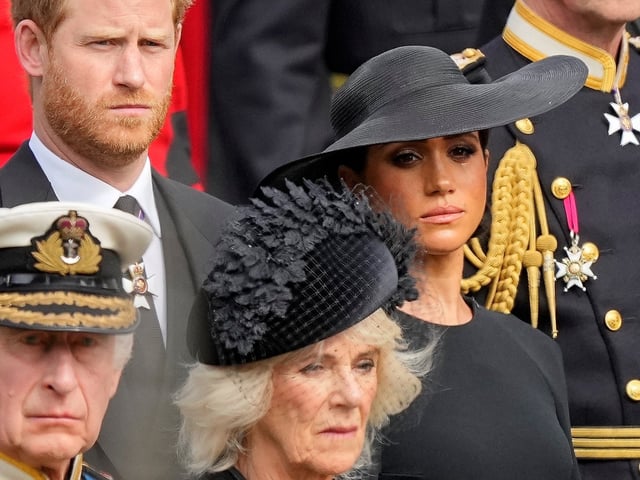 FILE - Britain's King Charles III, from bottom left, Camilla, the Queen Consort, Prince Harry and Meghan, Duchess of Sussex attend the state funeral service of Queen Elizabeth II in Westminster Abbey, London, Monday Sept. 19, 2022. Buckingham Palace says Prince Harry will attend the Coronation service of his father, King Charles III, at Westminster Abbey on May 6, setting aside months of speculation about his presence. (AP Photo/Martin Meissner, Pool File photo)