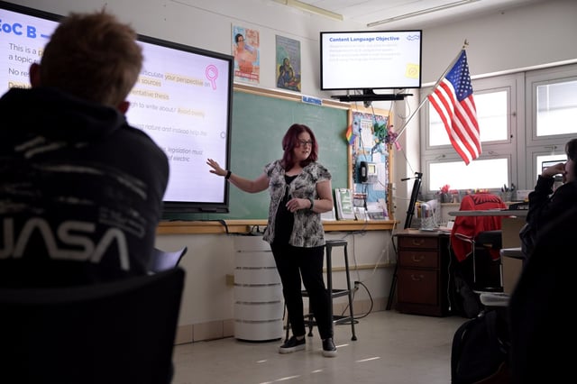 English teacher Amber Wilson explains about essay for final exam of semester to 11th grade students at Thomas Jefferson High School in Denver on Thursday, May 2, 2024. (Photo by Hyoung Chang/The Denver Post)