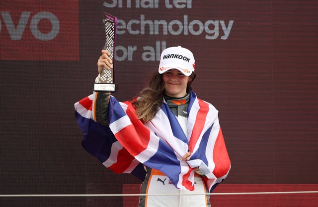 Formula One F1 - British Grand Prix - Silverstone Circuit, Silverstone, Britain - July 2, 2022 Racing X's Abbi Pulling celebrates with a trophy after finishing third in the W Series race REUTERS/Molly Darlington