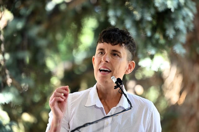 Andrea Gibson, Colorado’s ninth poet laureate, right, reads aloud one of two poems during a small gathering in their honor on the terrace at Chautauqua Auditorium in Boulder on Sept. 6, 2023.  Gibson — a queer activist, author and four-time Denver Grand Slam poetry champion — writes about the LGBTQ community, spirituality, feminism, mental health and gun reform, among other topics. (Photo by Helen H. Richardson/The Denver Post)