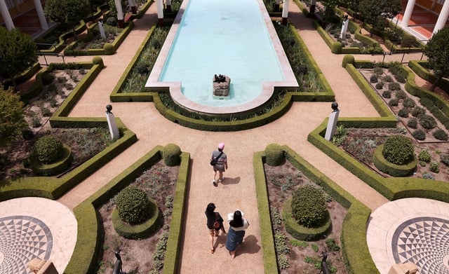 PACIFIC PALISADES, CA, JUNE 26, 2025: Visitors walk the grounds at The Getty Villa in Pacific Palisades on reopening day for the museum since the Palisades fire last January, on Friday, June 27, 2025. (Christina House / Los Angeles Times via Getty Images)