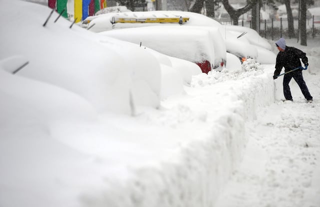A man shovels snow in Silver Spring, Maryland, on February 6, 2010. The storm, dubbed "Snowmageddon," stretched from Indiana to Pennsylvania and into parts of New York and North Carolina.