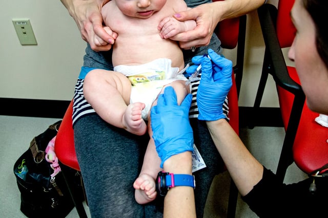 A baby receives a Prevnar Pneumococcal Meningitis vaccine at Intermed Pediatric Care in South Portland, Maine, on Feb. 5, 2015.