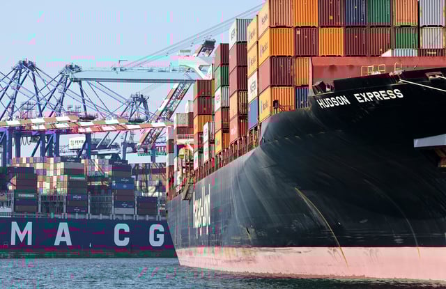 Shipping containers are stacked on container ships at the Port of Los Angeles on June 25.