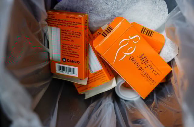 Used boxes of Mifepristone, the first pill in a medical abortion, line a trash can at Alamo Women's Clinic in Carbondale, Illinois, U.S., April 20, 2023. REUTERS/Evelyn Hockstein/File Photo