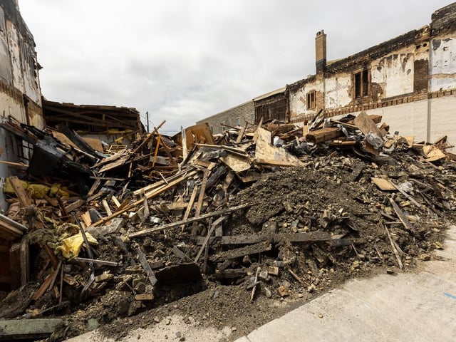  A pile of rubble is all that is left on Monday, July 7, 2025, after a building on Talbot Street in downtown St. Thomas was destroyed in a blaze the previous day. (Mike Hensen/The London Free Press)