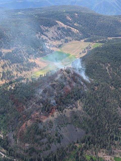 The August Lake wildfire, burning near Princeton, is seen from the air on the morning of July 14.