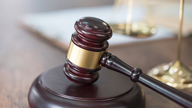 A gavel rests on a desk in this undated photo.