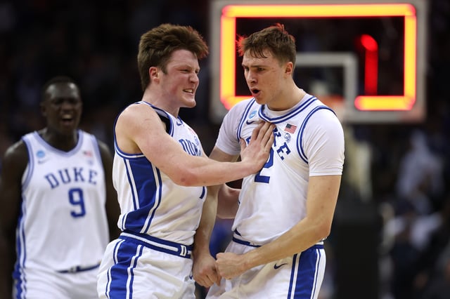 Cooper Flagg #2 and Kon Knueppel #7 of the Duke Blue Devils react after Flagg scored a three point basket to end the first half against the Arizona Wildcats in the East Regional Sweet Sixteen round of the NCAA Men&#39;s Basketball Tournament at Prudential Center on March 27, 2025 in Newark, New Jersey.
