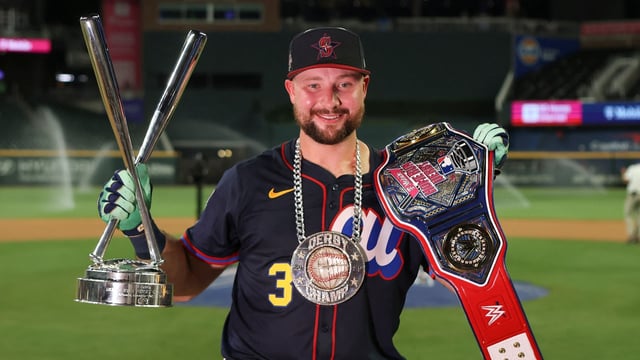 Seattle Mariners catcher Cal Raleigh (29) holds the trophy after winning the 2025 Home Run Derby