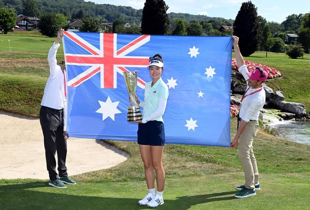 Grace Kim of Australia poses for a photograph with The Amundi Evian Championship 2025 trophy.
