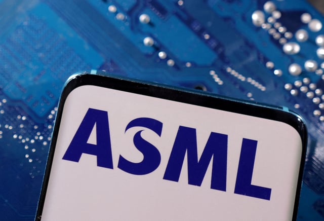 A smartphone with a displayed ASML logo is placed on a computer motherboard in this illustration taken March 6, 2023. REUTERS/Dado Ruvic/Illustration/File Photo