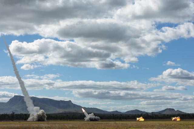 Four Australian Army High Mobility Artillery Rocket System (HIMARS) launch rockets at Shoalwater Bay Training Area in Queensland, Australia, during Exercise Talisman Sabre 2025 on July 13, 2025.