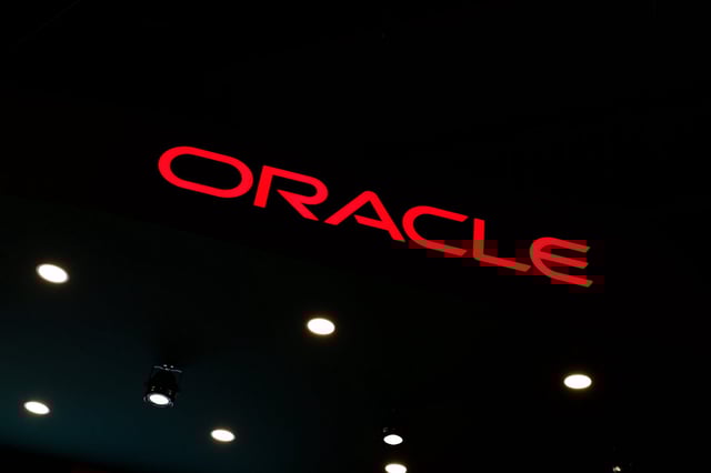 The Oracle logo, representing the American multinational computer technology company that sells database software and cloud computing products such as enterprise resource planning (ERP), human capital management (HCM), customer relationship management (CRM), and enterprise performance management (EPM), appears on their pavilion during the Mobile World Congress 2025 in Barcelona, Spain, on March 5, 2025. (Photo by Joan Cros/NurPhoto)