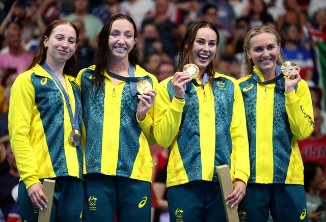 NANTERRE, FRANCE - AUGUST 01: Gold Medalists Mollie O’Callaghan, Lani Pallister, Brianna Throssell and Ariarne Titmus of Team Australia pose on the podium during the Swimming medal ceremony after the Women&#39;s 4x200m Freestyle Relay Final on day six of the Olympic Games Paris 2024 at Paris La Defense Arena on August 01, 2024 in Nanterre, France. (Photo by Adam Pretty/Getty Images)