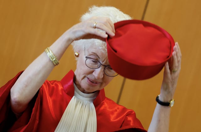 German Constitutional Court second senate vice president Doris Koenig takes off her hat before announcing a verdict at Germany's Federal Constitutional Court on the 2012 U.S. drone strikes in Yemen, that were steered from the U.S. air base in Ramstein, in Karlsruhe, Germany, July 15, 2025. REUTERS/Heiko Becker