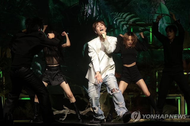 Singer Onew performs "Animals," the lead single of his second studio album, "Percent," during a media showcase in Seoul on July 15, 2025. (Yonhap)