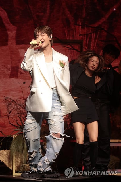 Singer Onew performs "Animals," the lead single of his second studio album, "Percent," during a media showcase in Seoul on July 15, 2025. (Yonhap)