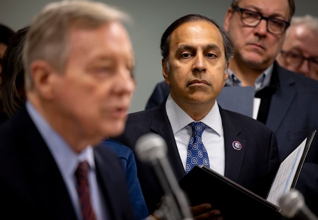 U.S. Rep. Raja Krishnamoorthi, 8th, listens while U.S. Sen. Dick Durbin speaks Feb. 17, 2025, as Illinois officials gathered in Chicago to oppose federal cuts. (Brian Cassella/Chicago Tribune)