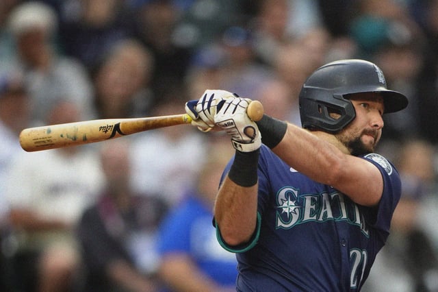 Cal Raleigh swings the bat during a Seattle Mariners game against the Chicago White Sox on June 11, 2024.