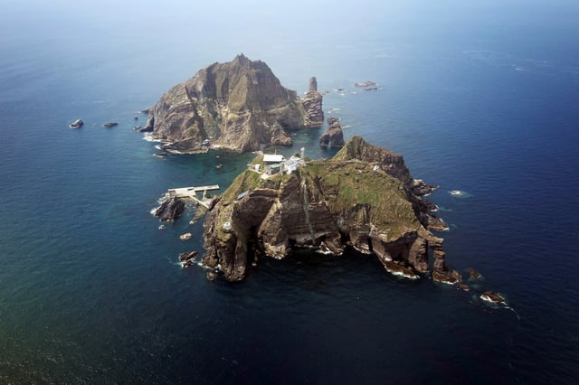 A set of remote islands called Dokdo in Korean and Takeshima in Japanese is seen in this picture, east of Seoul August 10, 2012. REUTERS/The Blue House/Handout/File Photo