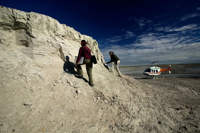 Researchers surveying the unique sedimentary context of the Haughton Formation.