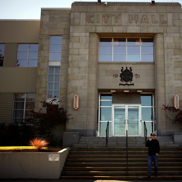 A man on his cell phone walks down the stairs at City Hall in Nanaimo, B.C., Tuesday, October 16, 2018. Chad Hipolito/The Globe and Mail