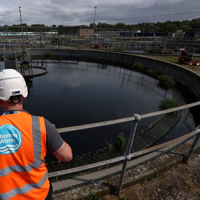 Ashley Book, Head of Waste Operations at Mogden Catchment, looks at settlement tanks used to process sewage water from over two million people, at Mogden Sewage Treatment Works, operated by Thames Water, in west London, Britain, June 4, 2025. REUTERS/Toby Melville