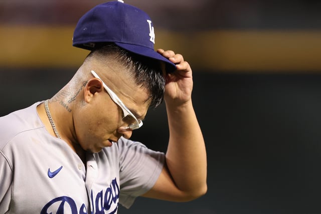PHOENIX, ARIZONA - AUGUST 08: Starting pitcher Julio Urias #7 of the Los Angeles Dodgers reacts after pitching out of the sixth inning of the MLB game against the Arizona Diamondbacks at Chase Field on August 08, 2023 in Phoenix, Arizona. (Photo by Christian Petersen/Getty Images)