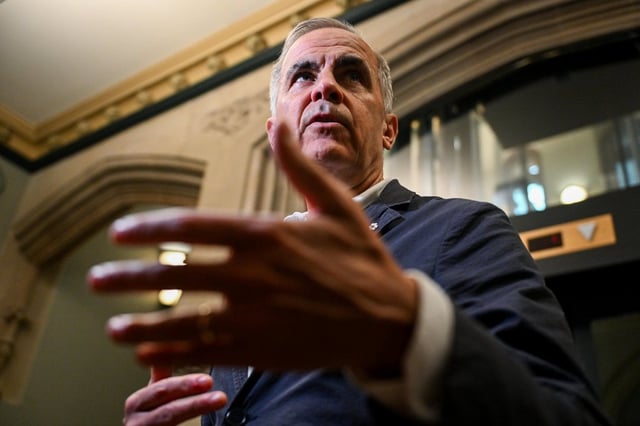 Prime Minister Mark Carney speaks with reporters Parliament Hill in Ottawa on Monday, June 30, 2025. 