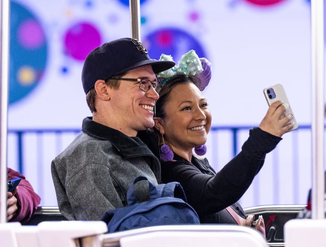 Anaheim, CA - February 23: A couple take a selfie on one of the parking lot trams at Disneyland in Anaheim, CA on Wednesday, February 23, 2022. The trams had been closed for two years during the pandemic. (Photo by Paul Bersebach/MediaNews Group/Orange County Register via Getty Images)
